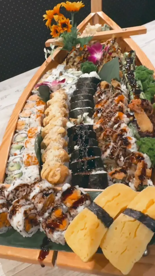 Wasabi Sushi & Thai in Columbus showing sushi boat, sushi rolls, video by Wasabi Sushi and Bar on Facebook