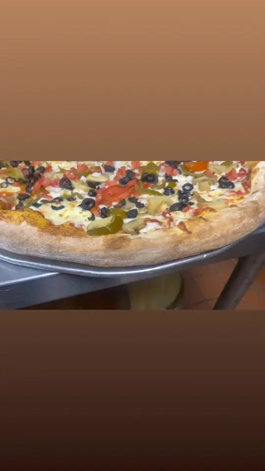 Westshore Pizza in Tampa showing pizza, video by Original Westshore Pizza South Tampa on Facebook