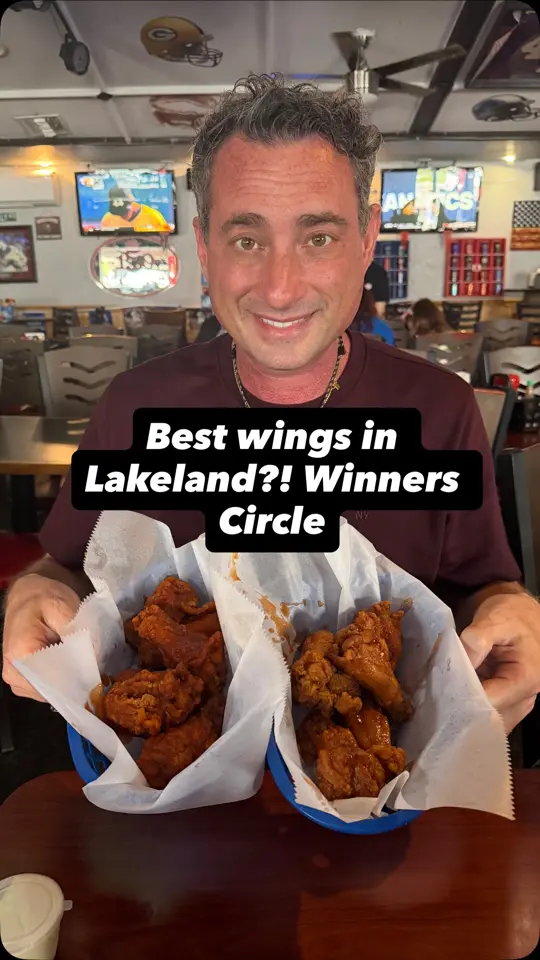 Winners Circle Sportsbar & Grill in Lakeland showing visit, wings, peanut butter and jelly wings, insane wings, video by Foodie Justice on Facebook
