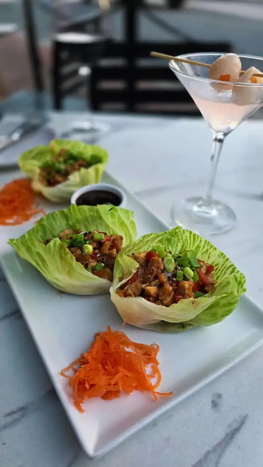 Zest in Roswell showing dinner, thai lettuce wraps, calamari with sweet sauce/wasabi aioli, volcano roll, lychee martini, pinot noir wine, video by mrmichaelbrown on TikTok