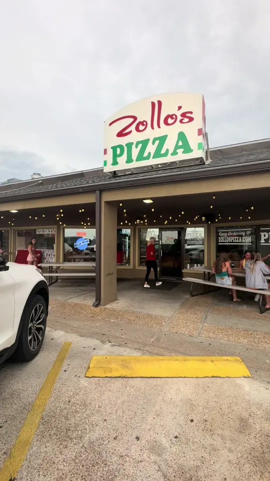 Zollo's Pizza in Panama City Beach showing pizza, gluten free options, outdoor seating, beachside dining, video by elizabeth.seaborne on TikTok