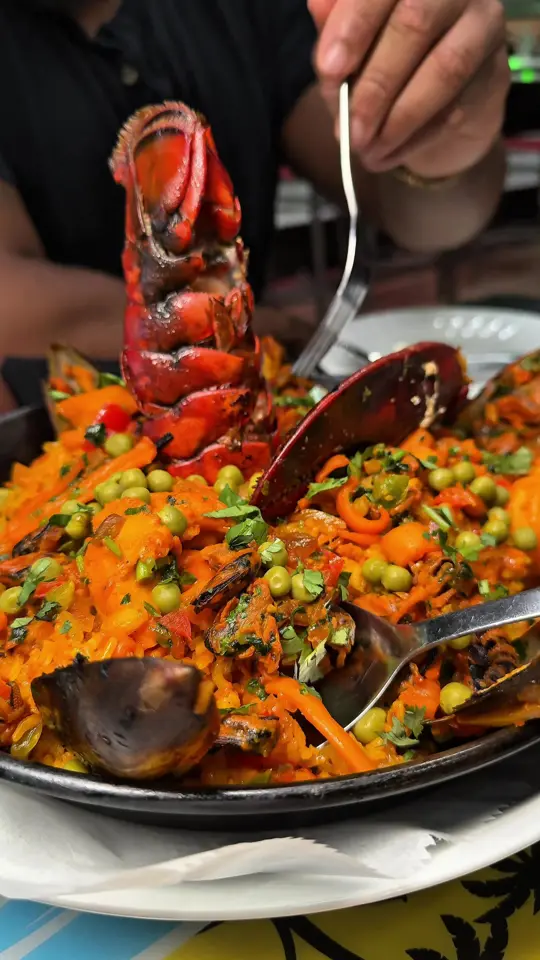 Zona Caribbean in Norcross showing review, visit, food, beef empanadas, paella seafood, outdoor patio, bar, hookah, live dj, video by great_eats on TikTok